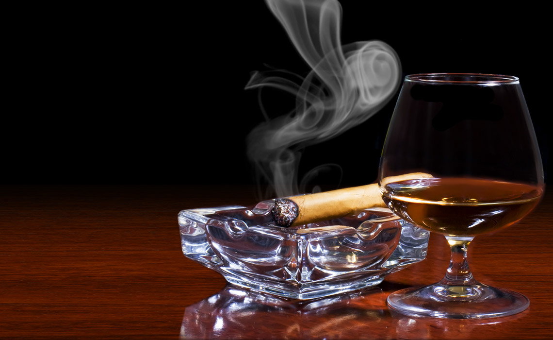 Match Cigar Bar atmosphere with premium cigars and bourbon